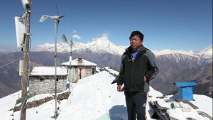 Mr. Mahabir Pun inspecting a wireless relay station.